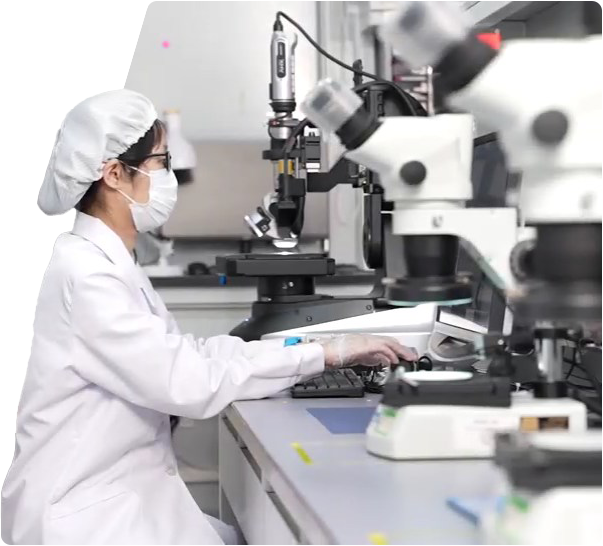 Able Test Laboratory worker using a microscope to analyze the functionality and authenticity of electronic components, ensuring quality and performance standards